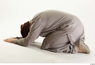 Luis Donovan Afgan Civil Praying kneeling praying whole body 0003.jpg